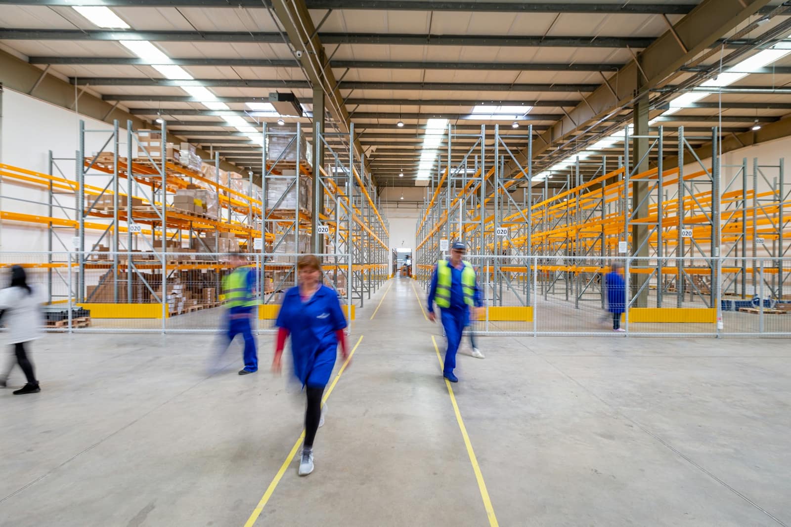 A wide distribution-centre aisle lined with racking